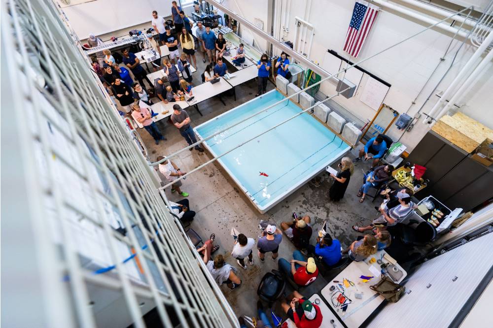 A view of the pool and fans set up to blow the boats across the pool from above